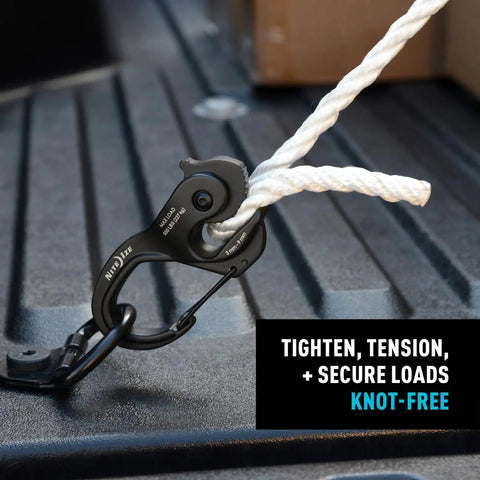 CamJam XT Aluminum Rope Tightener Large With Carabiner Clip used to secure white rope on truck bed