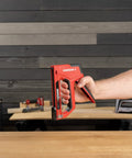 Person holding 5-In-1 Manual Staple And Nail Gun For Woodworking And Craft Projects Wire Stapler And Brad Nailer In One Handy Tool