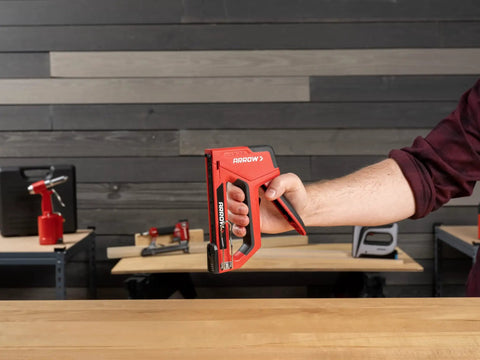 Person holding 5-In-1 Manual Staple And Nail Gun For Woodworking And Craft Projects Wire Stapler And Brad Nailer In One Handy Tool