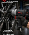 Pro Grade 1/2 Inch Air Impact Wrench 1245 Ft Lbs Max Torque Twin Hammer Design being used on SUV wheel with visible tire and wrench.