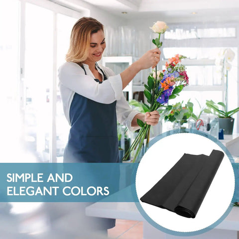 Florist arranging flowers with Black Flower Wrapping Paper Set, 40 Sheets, Cuttable Design For DIY Bouquets, Lightweight Floral Paper
