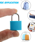 Person holding blue lock from 4 Pack Multicolor Metal Luggage Locks With Keys Keyed Padlocks Plastic Covered Copper.