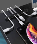 Three Pack Cable Holder Clips For Cord Management Self Adhesive Silicone Clips holding USB cables on desk