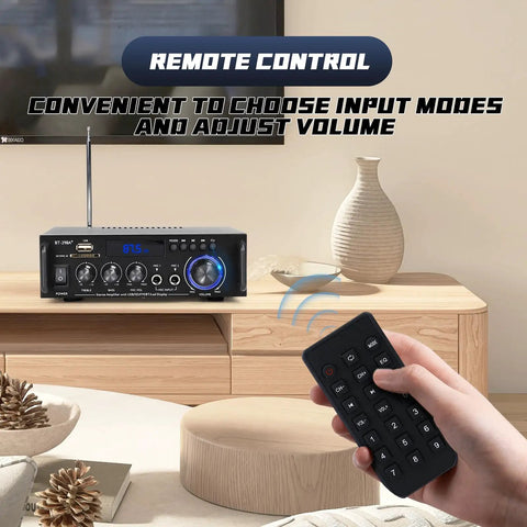 Hand holding remote control for Powerful 300W Stereo Amplifier System With Bluetooth 5.0 Wireless 2 Channel Home Theater Audio FM Radio.
