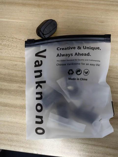 Transparent bag with text on wooden table, containing items related to Six Pack Golf Ball Pick Up Retriever Grabber Set.