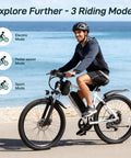 Rider on OUREA 26 Electric Bike For Adults, 750W Peak Motor All Terrain Ebike with ocean background, showcasing 3 riding modes.