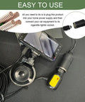 Rugged Ride Ready AC DC Converter Adapter plugged into cigarette lighter socket with smartphone for car accessories.