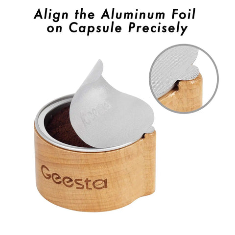 Reusable Aluminum Foil Seals Kit for Nespresso VertuoLine Capsules in wooden holder showing foil alignment.
