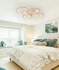Cool 8-Ring LED Dimmable Ceiling Light With Remote, white flush mount in modern bedroom setting, elegant design.