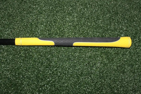 True Flex Swing Tempo Trainer grip detail with yellow handle, durable polyurethane head, 46-inch shaft for golfers to flatten swing plane.