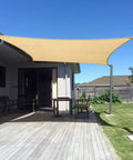 Sun Shade Sail 10x13 Ft Rectangle For Backyard Patio And Garden Blocks Up To 95 Percent UV Breathable Cooling Shade installed on patio.