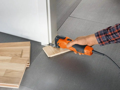 Beast Of An Oscillating Tool Kit For Interior Renovation With 350W Motor used to cut wood flooring near doorframe