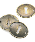 Top Tier 10 Pack Zinc Alloy Oval Keyhole Escutcheons Heavy Duty Antique Bronze Lock Covers showing three oval lock plates.