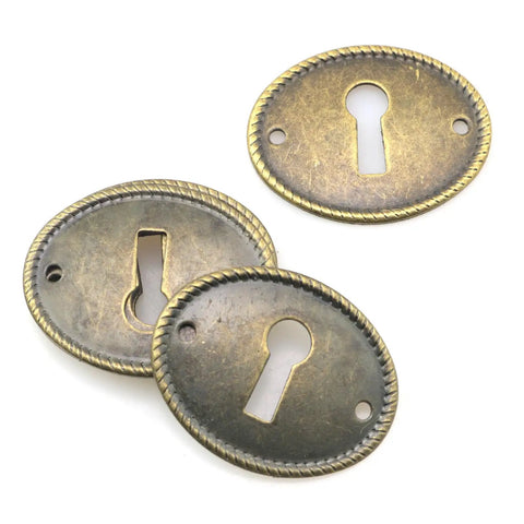 Top Tier 10 Pack Zinc Alloy Oval Keyhole Escutcheons Heavy Duty Antique Bronze Lock Covers showing three oval lock plates.