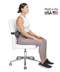 Get The Original McKenzie Early Compliance Lumbar Roll, A Smaller Ergonomic Back Support Pillow With Strap For Proper Spine Alignment in use on office chair.