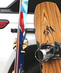 Badass Magnetic Ski And Snowboard Vehicle Rack Keeping Your Ride Spotless With Soft Waterproof Padding For Reliable All Season Winter Storage And Trail Ready Adventures mounted on car with skis and snowboard.