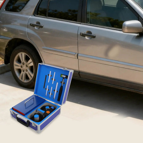 Portable Electric Dent Repair Kit With 1380W Paintless Dent Puller And 110V US Plug Induction Heater next to a car