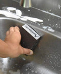 Person using Four Grit Sanding Sponge Set 60 80 120 220 Grits, 4 x 2.8 x 1 Inch Assorted Block on metal surface in sink