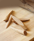 Fifty Pack Solid Wood Pocket Hole Plugs Blend Into A Legit Clean Finish On Any Woodworking Build Perfectly Aligns With Standard Jigs Delivers A Bulletproof Seam With Zero Sanding Hassle Guaranteed, five oak dowels displayed on wood.