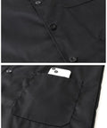 Close-up of deep pocket holding a smartphone on the Durable Mechanic Lab Coat For Men Workwear Long Black Coat For Woodworking Shop Floor Tasks Built From 80 Percent Polyester 20 Percent Cotton Blend Not Flame Resistant With Deep Pockets And Comfortable Fit For Daily Heavy Duty Use.