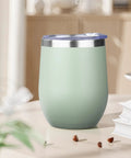 12oz Double Wall Vacuum Insulated Stemless Wine Tumbler With Straw And Lid Stainless Steel Cup on table in soft green color.