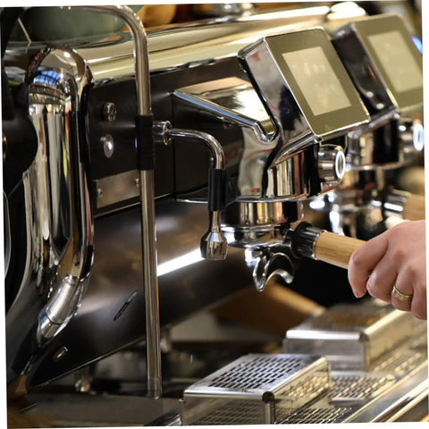 Person using espresso machine with Heat Resistant Steam Pipe Sleeve Replacement Kit For Coffee Maker Steam Wand installed