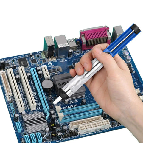 Hand using desoldering pump from 80W All In One Soldering Iron And Soldering Gun Kit With Ceramic Heater 10 In 1 on electronic circuit board