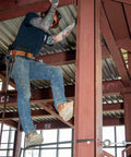 Person using Ergonomic Round Connecting Bar 7/8 Inch Wide By 30 Inch Long With 15 Degree Angled Chisel on steel structure