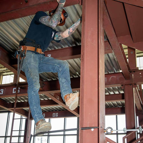 Person using Ergonomic Round Connecting Bar 7/8 Inch Wide By 30 Inch Long With 15 Degree Angled Chisel on steel structure