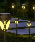 Six Pack Warm White Solar Pathway LED Lights With Spike Stands Waterproof Outdoor Garden Lawn Driveway Walkway Landscape Lighting For Patio Street And Yard illuminating garden path at night