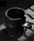 Boss Level 58Mm Espresso Tamping Station With Slick Anti Slip Base And Quick Adjustable Frame For Hassle Free Coffee Tamping Plus Nifty Grounds Catch Tray side view on textured surface.