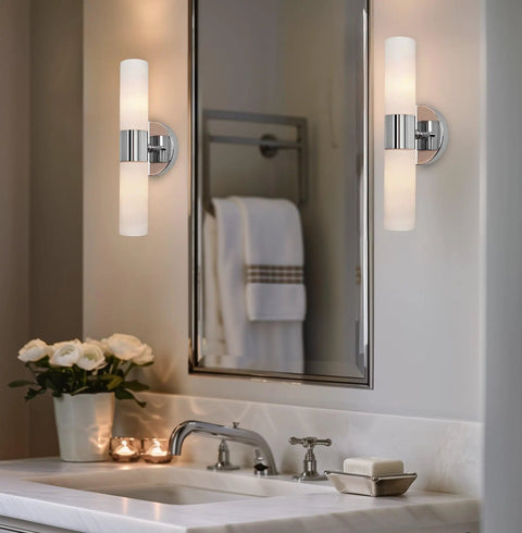 Dual 14 Inch Modern Wall Sconce With Frosted Glass Cylinder Shades In Chrome Finish in bathroom setting