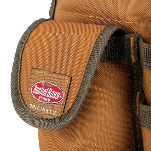 Close-up of Bucketeer Bucket Tool Organizer label and pocket in brown, fits most 5 gallon buckets with loops for long tools.