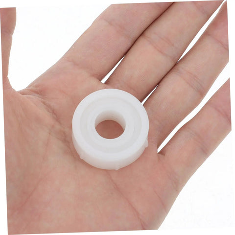No Sweat Two Sets Grinding Wheel Diameter Sleeves Plastic Bushing Adapter Kit For Bench Grinder shown in hand.