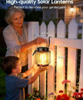 Woman and child with Metal Outdoor Solar Lanterns 2 Pack Waterproof Hanging Lights For Yard Patio Path Garden Decor Up To 15 Hours