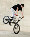 BMX rider performing a trick, showcasing durability of 20 Inch Bike Inner Tube Fits 2.125 To 2.40 Inch Width Tires With Schrader Valve