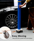 Person using Portable Vinyl Roll Rack Stand With Lockable Caster Wheels For Mobile Car Wrap Material Rolls near car
