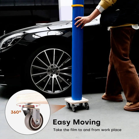 Person using Portable Vinyl Roll Rack Stand With Lockable Caster Wheels For Mobile Car Wrap Material Rolls near car
