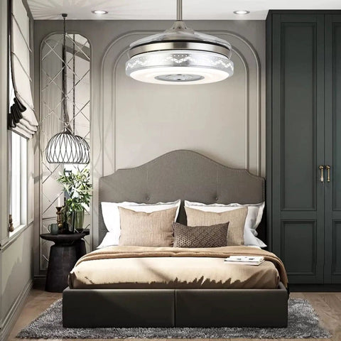 Retractable Ceiling Fan With Lights Bluetooth Speaker And Chandelier Remote Control Dope 42 Inch Silver in bedroom setting.
