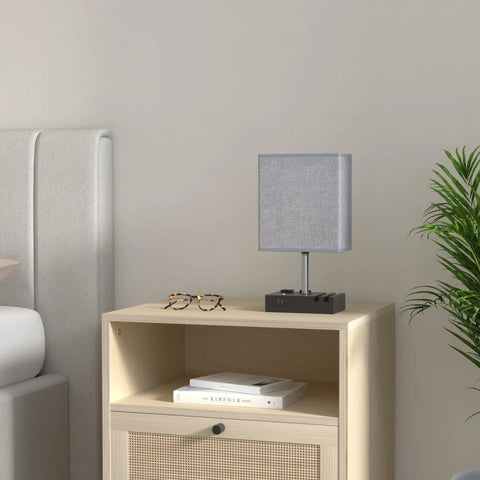 Fully Dimmable Bedside Table Lamp With Dual Phone Stands And AC Outlet on light grey nightstand