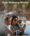People checking a dive computer with wellbeing monitor features, steps, calories, blood oxygen tracking.