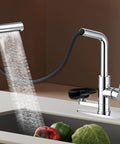 SINGSUO Pull Down Kitchen Faucet with Glass Rinser (Chrome) spraying water over vegetables in a modern kitchen sink.