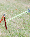 9 Inch Tent Stakes Set Lightweight Aluminum Alloy Ground Pegs for Outdoor Camping secured in grass with ropes