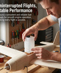 Man installing Clear 120CC RC Plane Fuel Tank Set With Metal Tubing And Engine Container in fixed-wing model aircraft