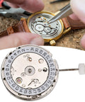 Premium Watch Movement Replacement Part Kit With 2813 Mechanical Movement, watch repair in progress, metal tools shown