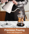 Person using Stainless Steel Gooseneck Electric Kettle for Pour Over Coffee, Fast 1000W Heating, Auto Shut Off, 27 Fl Oz Milk White