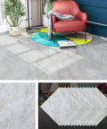 32 Pack Peel And Stick Floor Tiles 12x12 Light Grey Marble Vinyl Flooring in a living room setting with red chair and plant