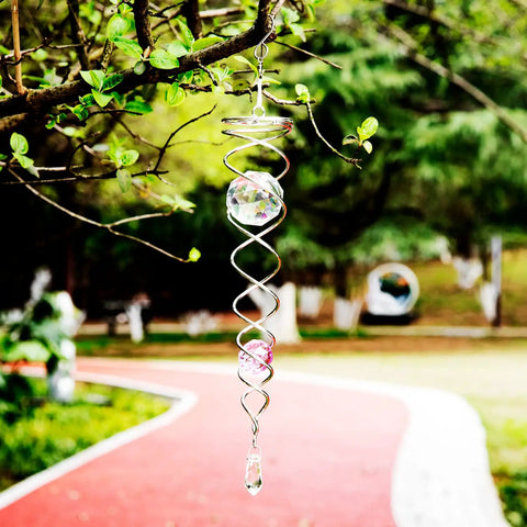 12 Inch Gazing Ball Spiral Tail Dope Wind Spinner With Stainless Steel Construction Two Crystal Glass Prism Balls Hanging Swivel Hook Weatherproof Outdoor Yard Garden Decor Purple hanging from a tree