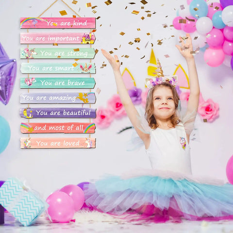 Girl in tutu with 9 Piece Inspirational Unicorn Rainbow Wall Art Set For Girls Bedroom With Wooden Signs And Positive Affirmations