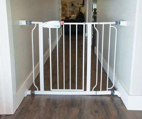 White gate with 6 Inch Gate Extension Guard For Child And Pet Gates That Adds 3 Inches Per Side Extends Pressure Mounted Gates Protects Walls And Baseboards Stabilizes Gate On Stairs Easy Install For Busy Homes installed in hallway
